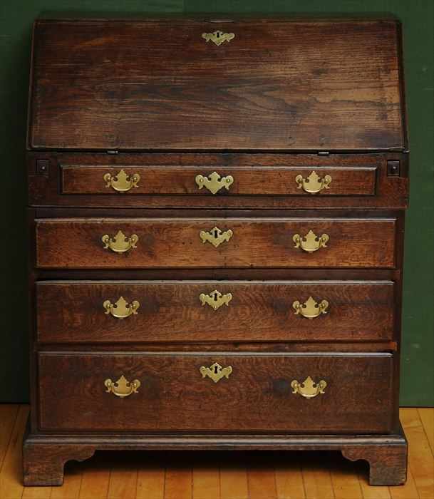 Appraisal: GEORGE II OAK BUREAU In two parts the slant lid