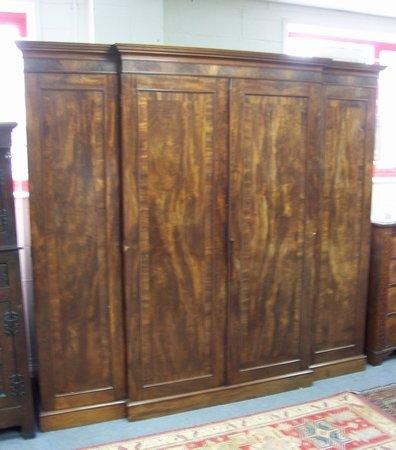 Appraisal: A gentleman's Victorian mahogany breakfront wardrobe the moulded cornice above