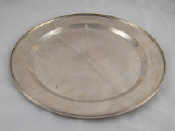 Appraisal: A silver circular salver with applied stiffening rim and finly