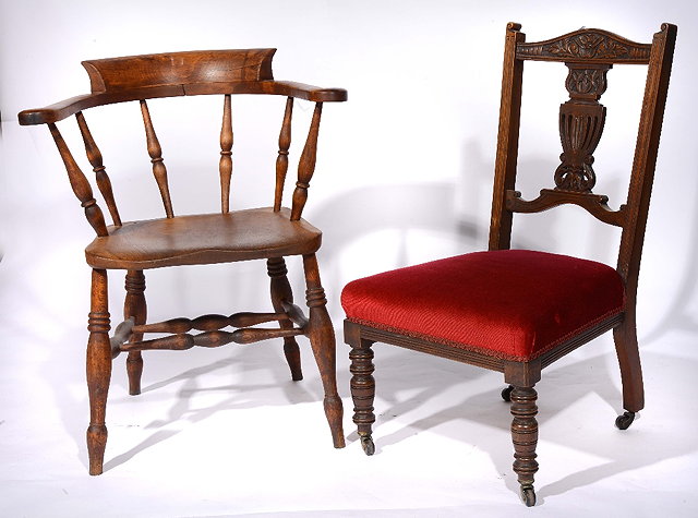 Appraisal: A Victorian smoker's bow elbow chairand a Victorian nursing chair