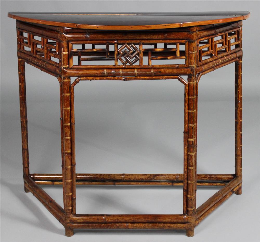 Appraisal: RATTAN CONSOLE TABLE with a demilune top over a base