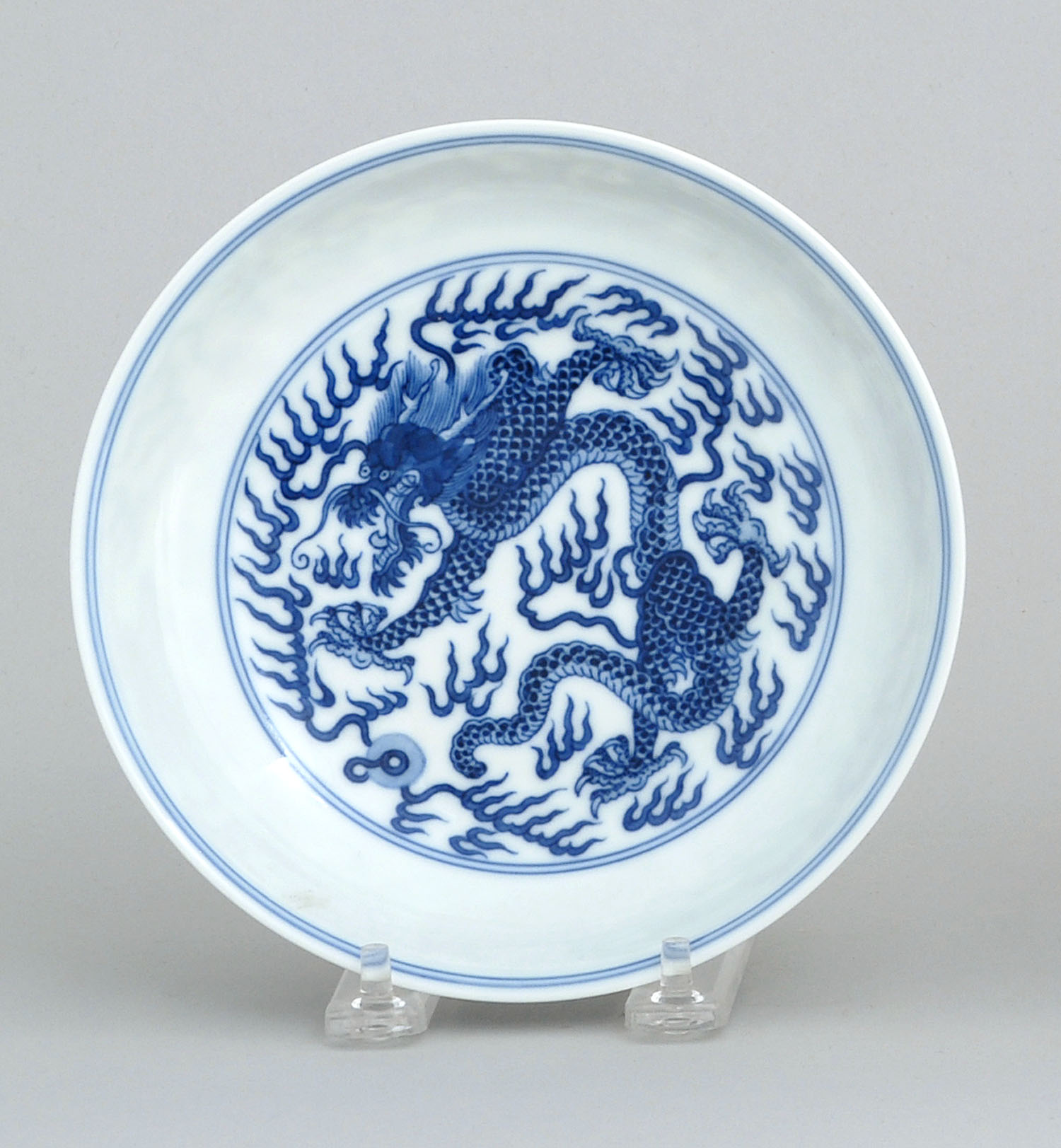 Appraisal: BLUE AND WHITE PORCELAIN PLATE With five-claw dragon and pearl