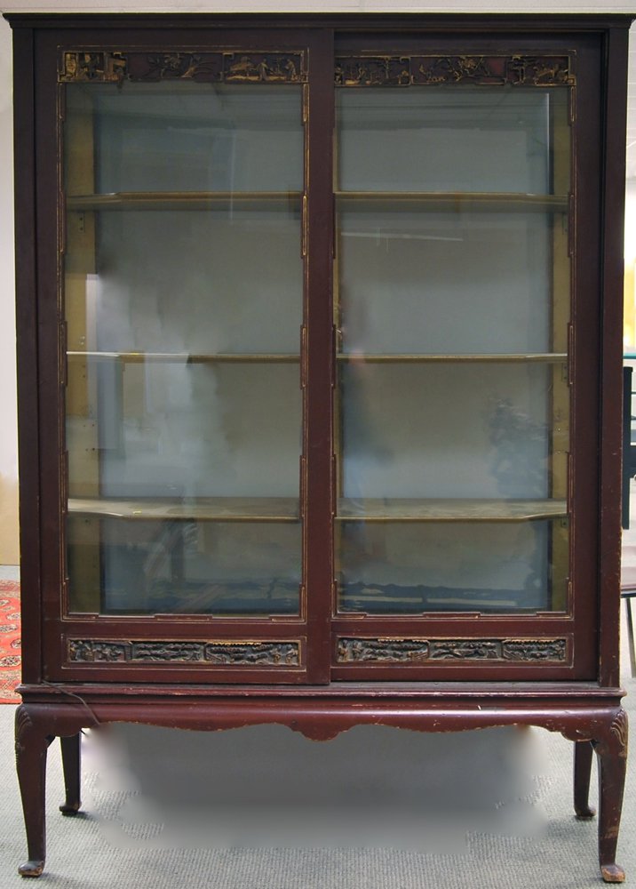 Appraisal: Asian-style Carved and Red-painted Glass Display Cabinet the two sliding