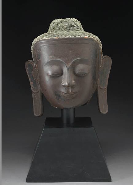 Appraisal: A massive Burmese dry lacquered head of a Buddha His