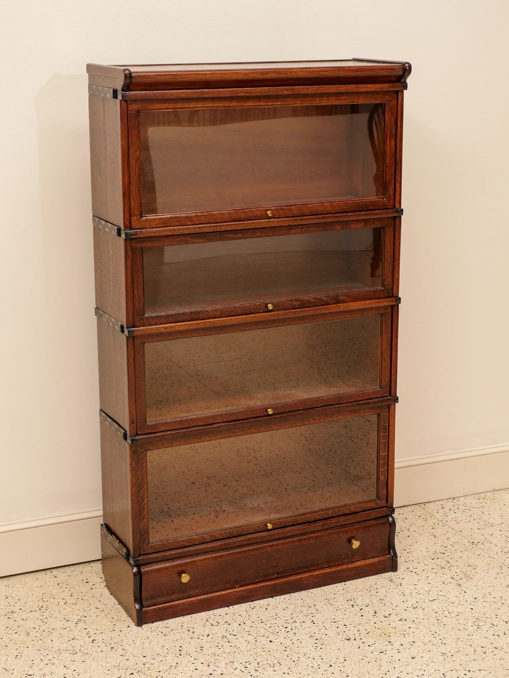 Appraisal: OAK BARRISTER BOOKCASE Oak shelf over drawer Barrister bookcase Lifting