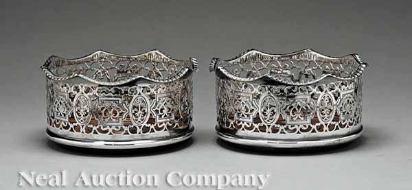 Appraisal: A Decorative Pair of Silverplate Reticulated Wine Coasters the turned