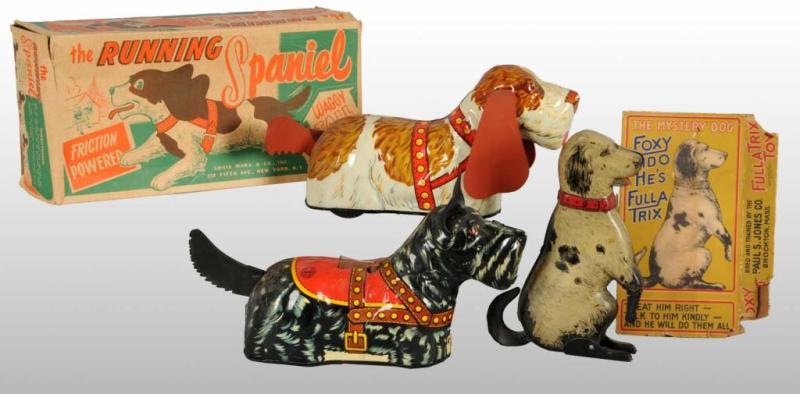 Appraisal: Lot of Tin Dog Toys Description American Includes circa Fido