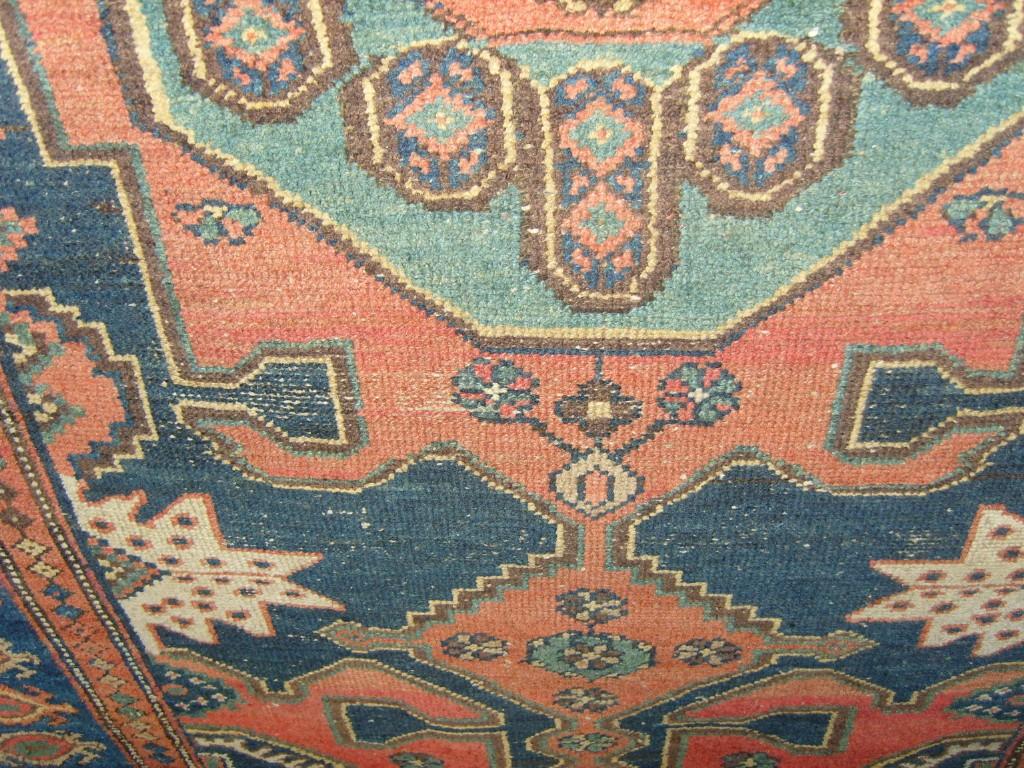 Appraisal: A Persian wool carpet with blue field central medallion within