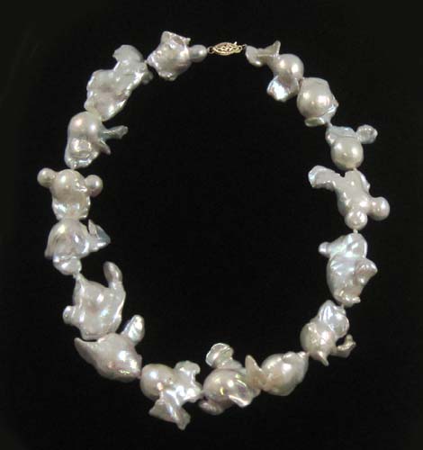 Appraisal: PRINCESS LENGTH BAROQUE PEARL NECKLACE strung with large white baroque