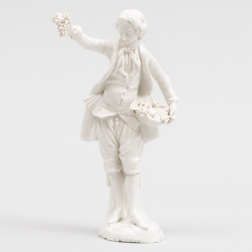 Appraisal: Vienna Porcelain White Figure of a Boy with Fruit Basket