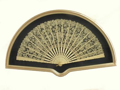 Appraisal: A fan c with ivory sticks carved in low relief