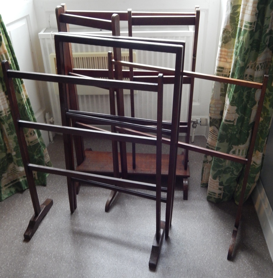 Appraisal: Four early thC mahogany clothes rails to include a triple