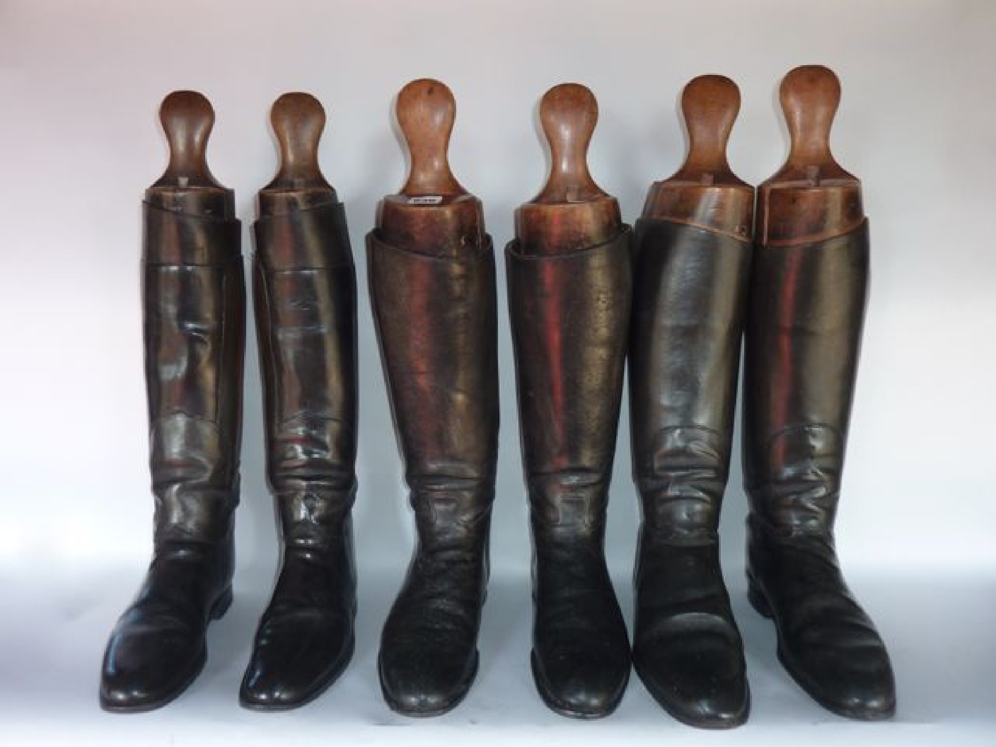 Appraisal: Three pairs of antique English black leather riding boots all