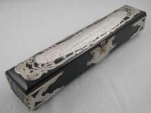 Appraisal: An ebony scroll casket with silver mounts and dedication panel