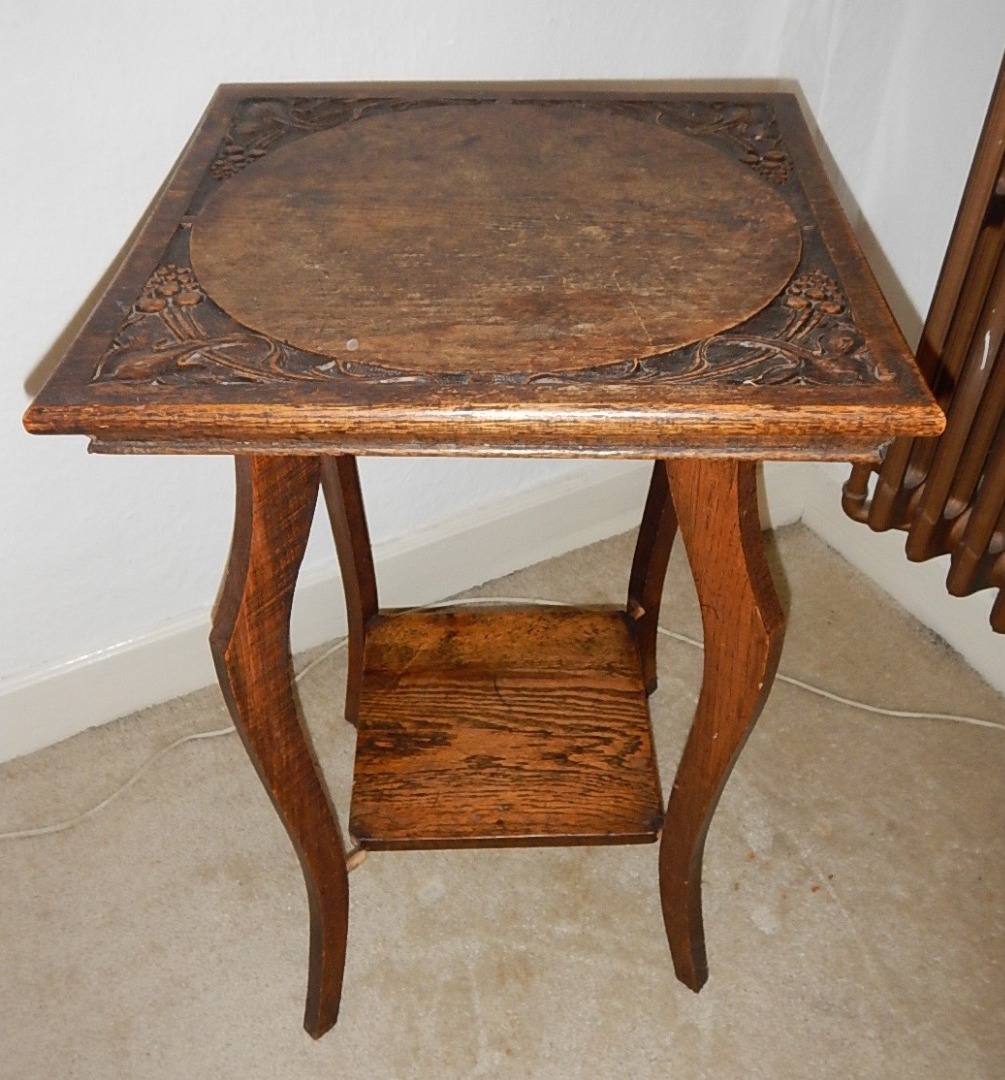 Appraisal: An Edwardian oak square occasional table carved with art nouveau