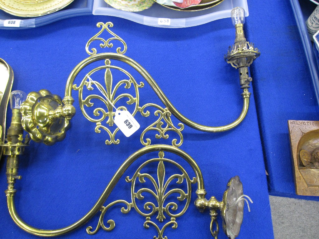 Appraisal: Two gilt metal wall lights with fleur de lys motifs