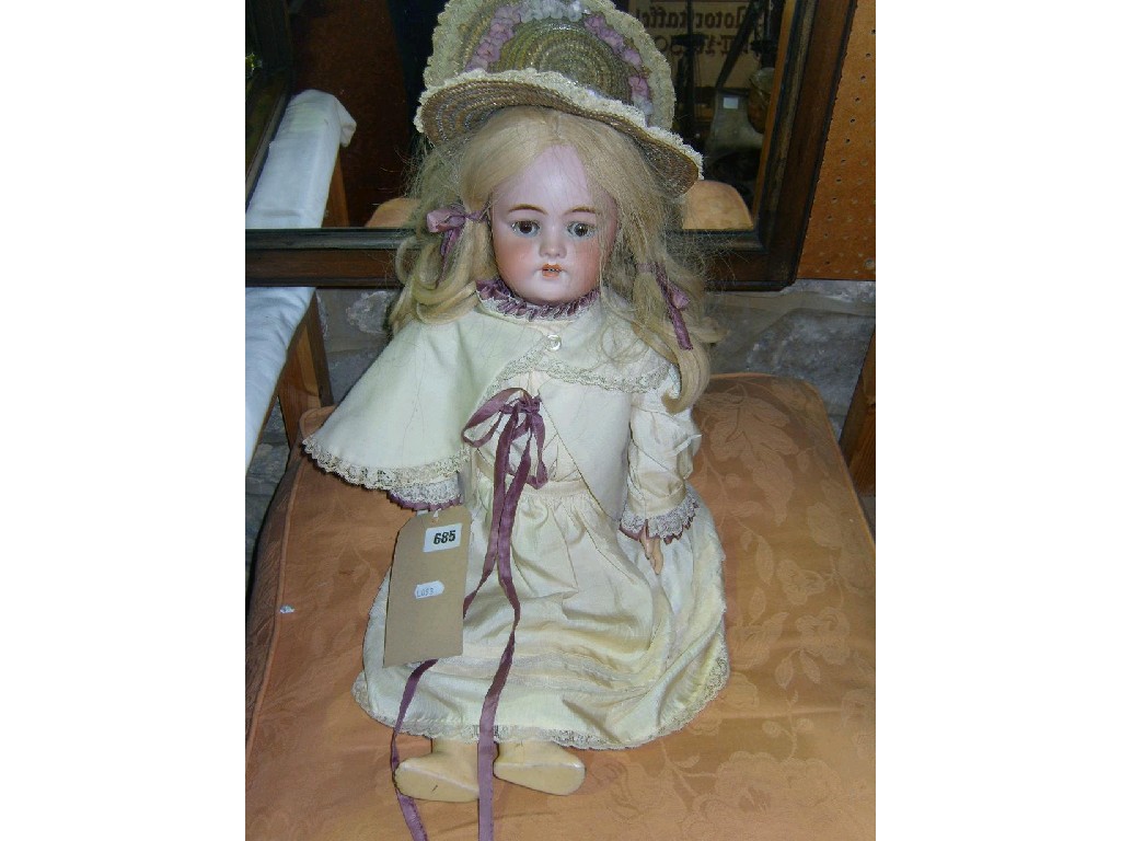 Appraisal: An early th century bisque headed doll with closing brown