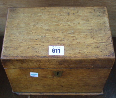 Appraisal: An Edwardian light oak stationary box with sloping hinged lid