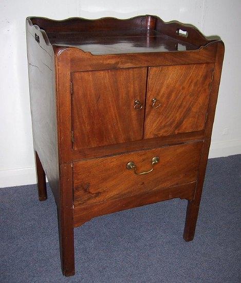 Appraisal: A George III mahogany tray top commode the galleried top