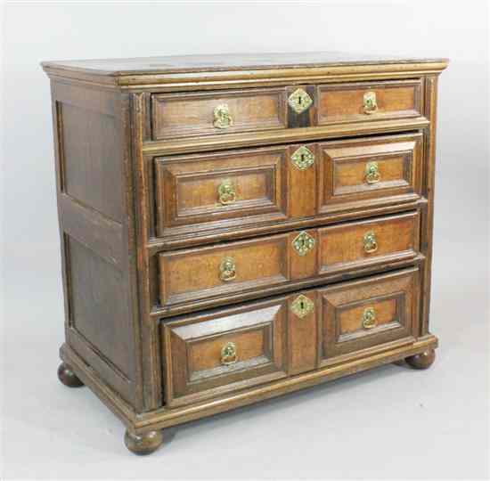 Appraisal: A late th century oak chest of four long drawers