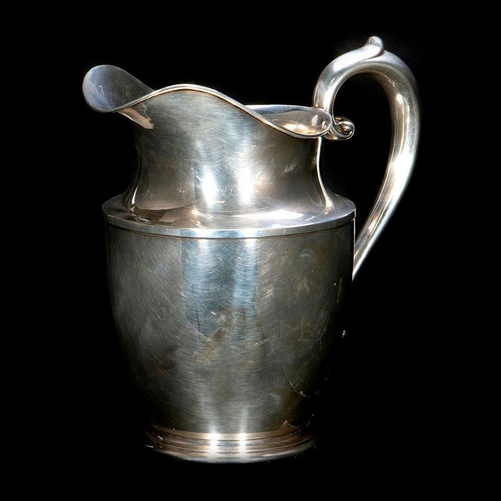 Appraisal: Sterling silver water jug Sterling silver water jug inches in