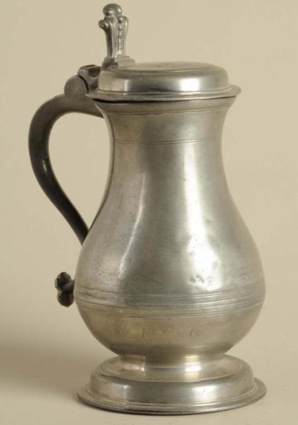 Appraisal: English Pewter Lidded Flagon Description The lid engraved with the