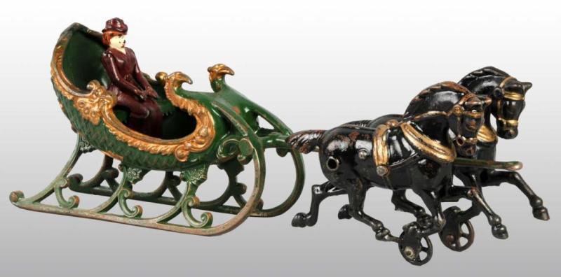 Appraisal: Cast Iron Hubley -Horse Sleigh Toy Description Includes one woman