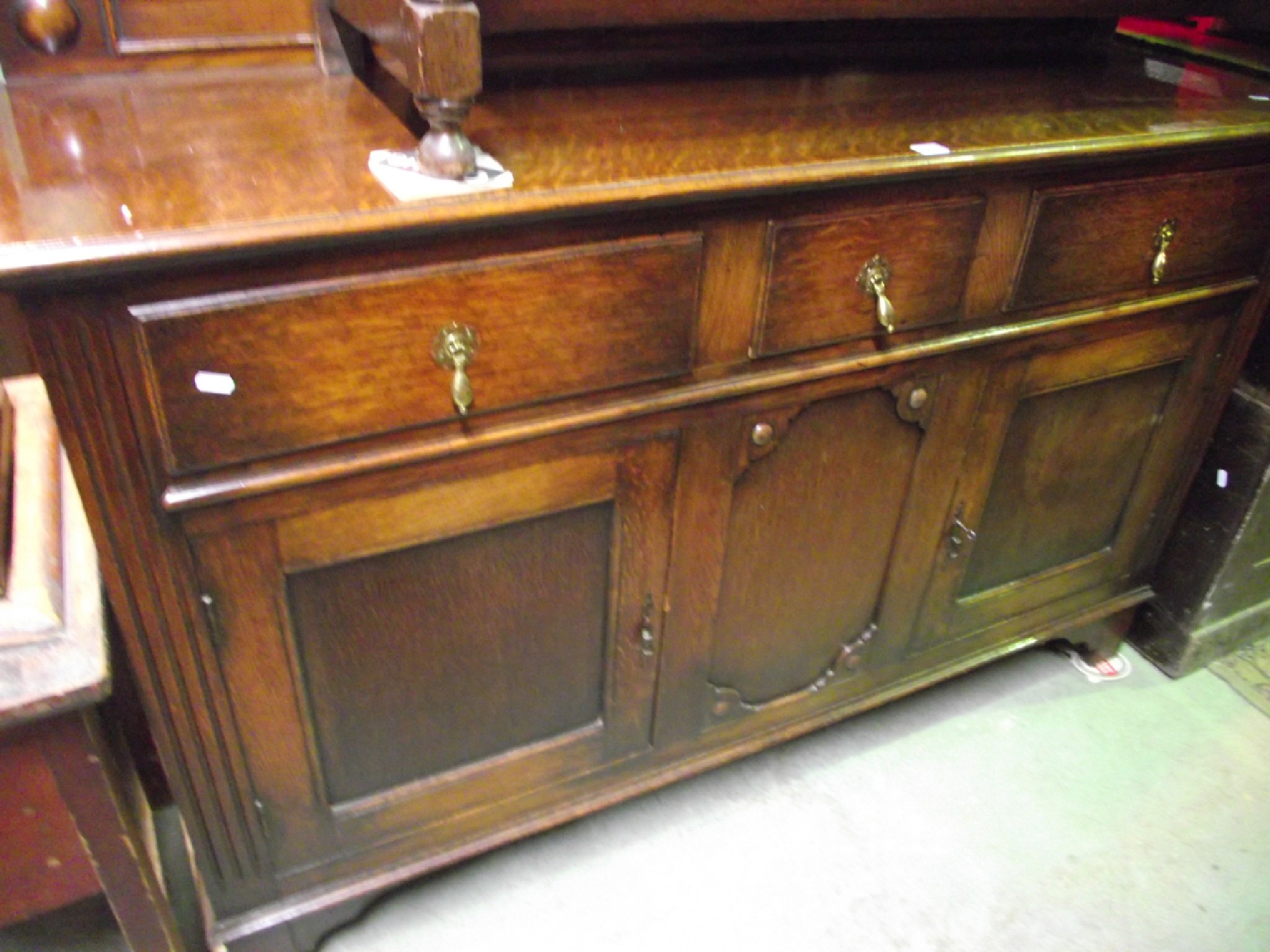 Appraisal: An Edwardian s oak sideboard the shallow raised back with