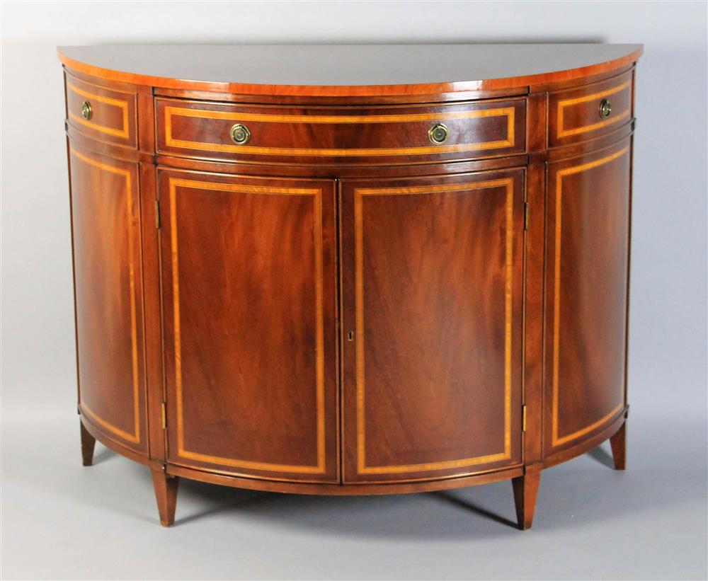 Appraisal: CLASSICAL STYLE DEMILUNE MAHOGANY BANDED CABINET the banded top with