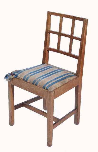 Appraisal: A Peter Waals Cotswold School oak chair lattice back upholstered