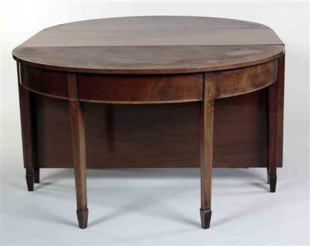 Appraisal: A late George III mahogany and chevron banded dining table