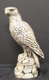 Appraisal: Silver Over Alabaster Sculpture of Eagle The raptor resting on