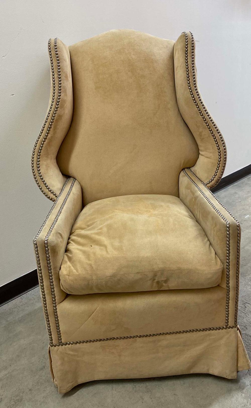 Appraisal: GEORGIAN STYLE SUEDE UPHOLSTERED PORTER S CHAIRWith scrolled wings beige