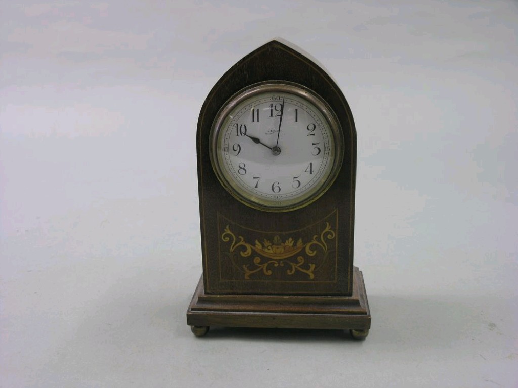 Appraisal: An Edwardian mahogany and marquetry mantel clock lancet shape with