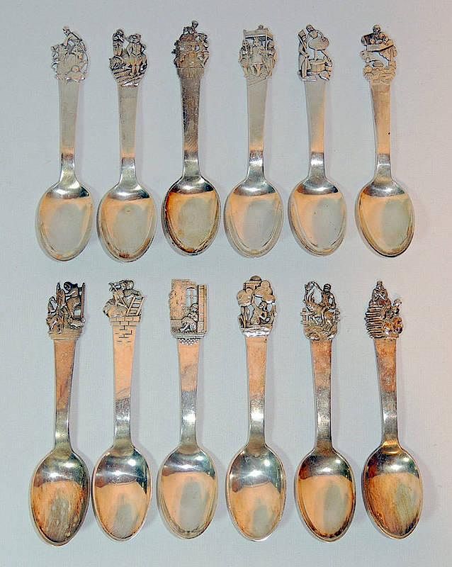 Appraisal: Twelve Danish Silver Spoons With figural decoration Three tower Copenhagen