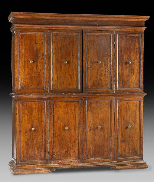 Appraisal: An Italian Baroque walnut cupboard The upper section with outstepped