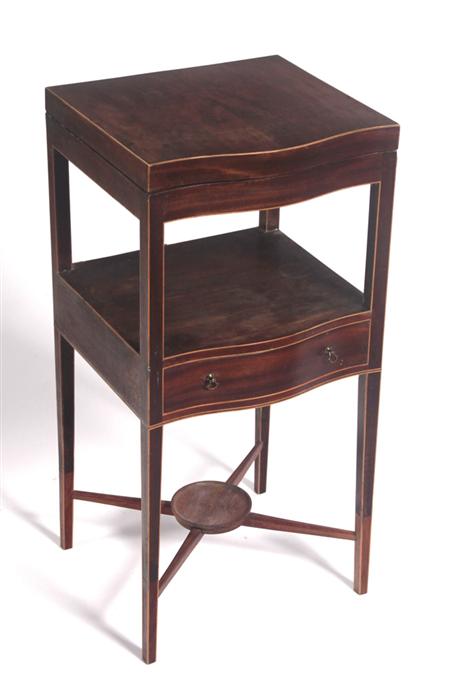 Appraisal: A Regency mahogany wash stand the boxwood strung serpentine lid