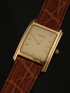 Appraisal: A Gents Gucci wristwatch Quartz rectangular gilded dial with raised