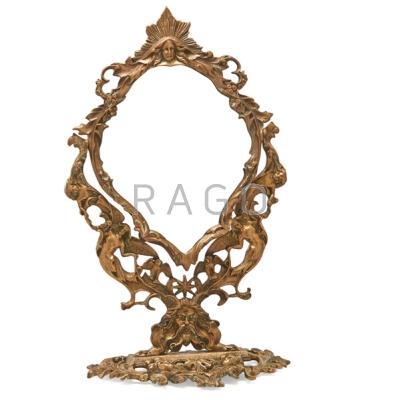 Appraisal: ART NOUVEAU DRESSING MIRROR Brass with beveled glass swivel frame