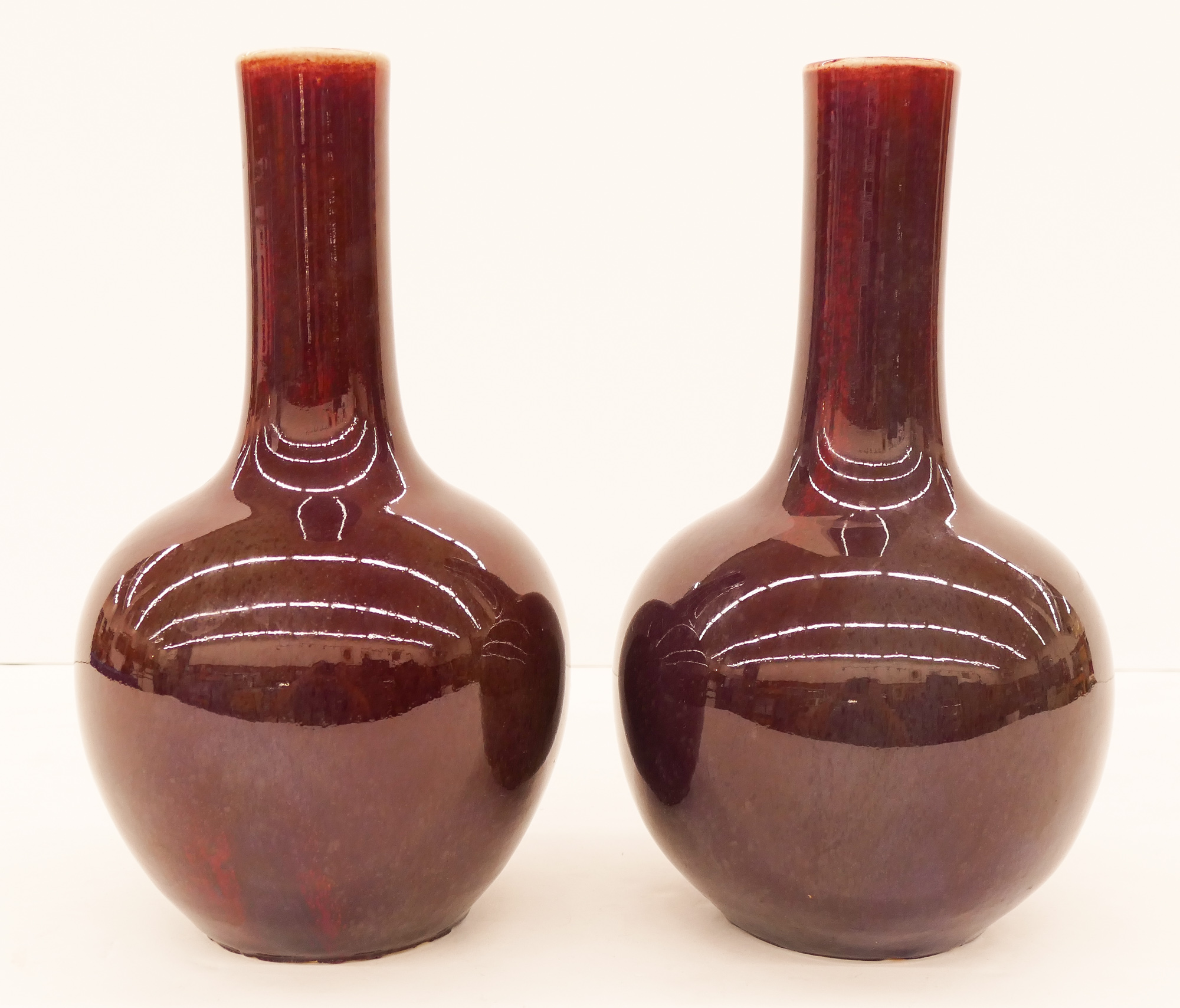 Appraisal: Pair Chinese Qing Plum Glazed Porcelain Bottle Vases ''x ''