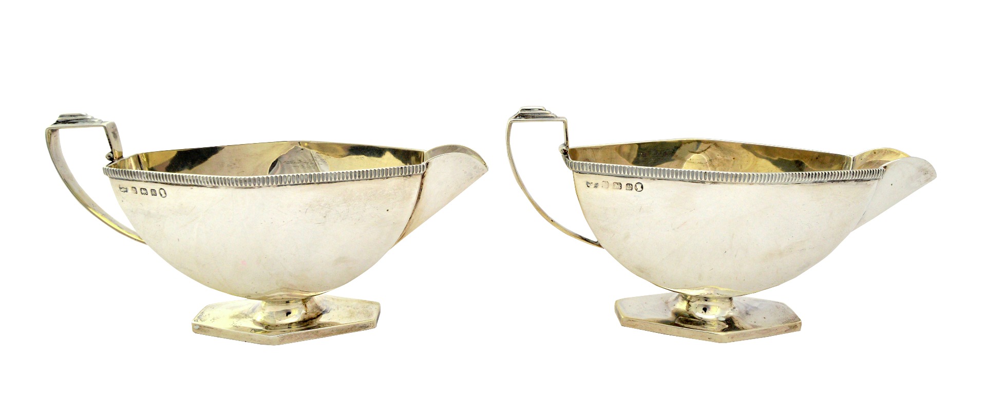 Appraisal: A pair of Art Deco silver sauceboats each with an