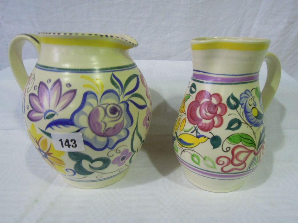 Appraisal: Two white earthenware Poole Pottery jugs one decorated with LE