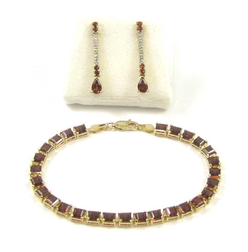 Appraisal: THREE ARTICLES OF GARNET JEWELRY including a pair of k