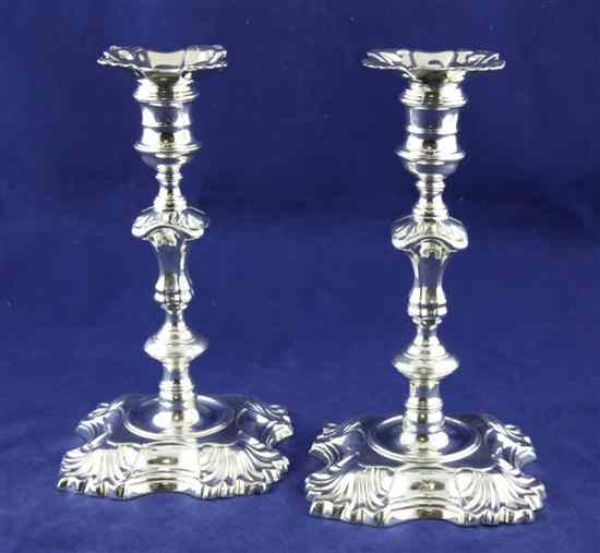 Appraisal: A pair of George II cast silver candlesticks by John