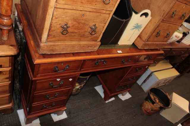 Appraisal: A CONTEMPORARY YEW WOOD PEDESTAL DESK with green leather inset