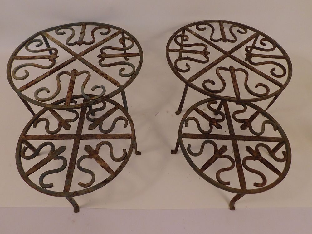 Appraisal: IRON PLANT STANDS Set of wrought iron Arts and Crafts