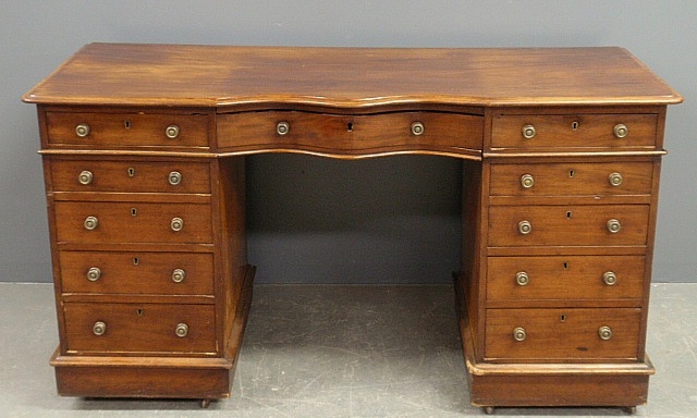 Appraisal: - Regency mahogany desk with a serpentine center drawer flanked