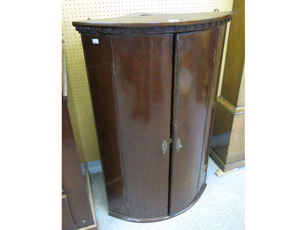 Appraisal: Georgian mahogany bow fronted hanging corner cabinet