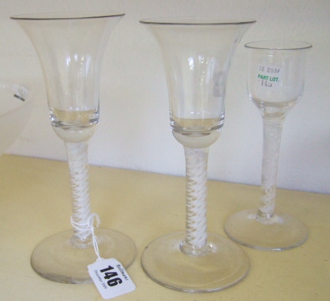 Appraisal: Three wine glasses th century with an opaque twist stems