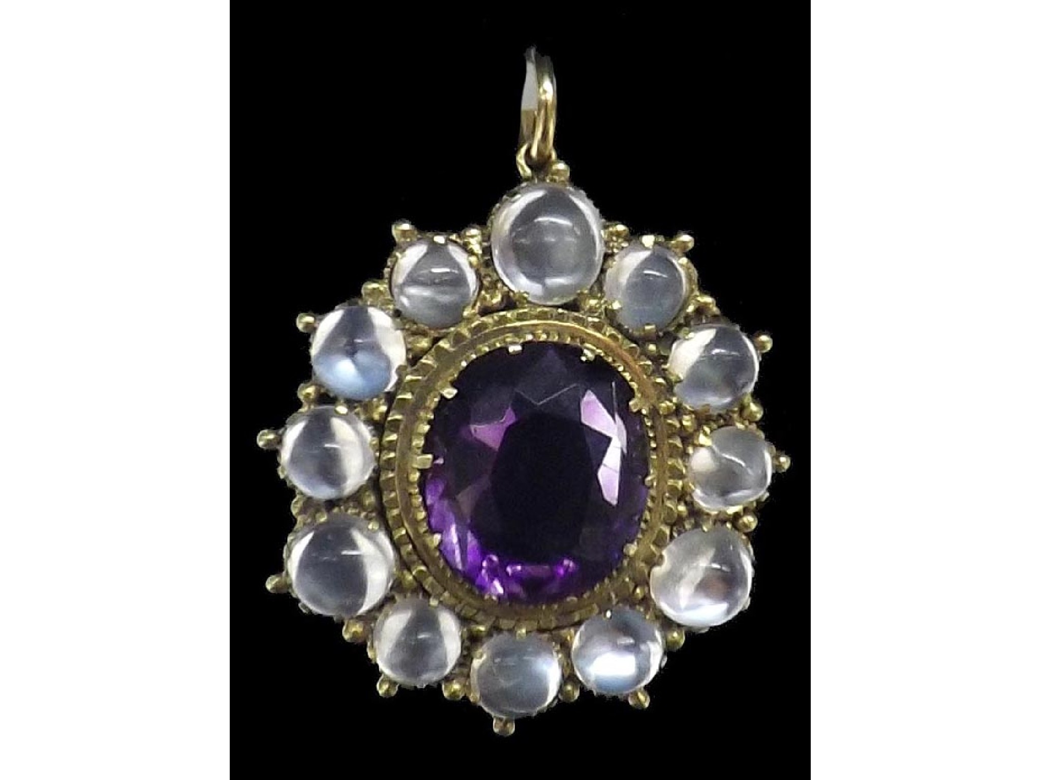 Appraisal: Amethyst and moonstone oval gold mounted pendant the oval-cut amethyst